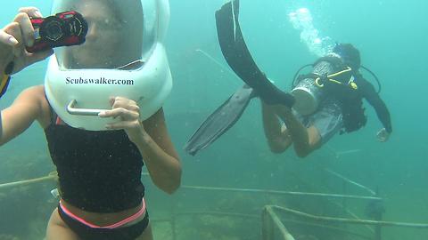 Underwater sea walking among the Coral Reefs of Borneo