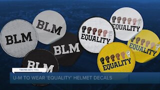 Michigan to display helmet decals with the word 'Equality' and raised fists