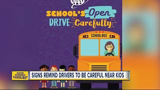 AAA signs popping up near busy roads and school zones reminding people to be careful around kids