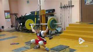 Weightlifter nearly takes his head off