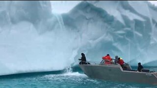 Explorers drink water from glacier spring