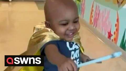 Hero toddler who's beaten cancer wears his special cape into last round of chemo