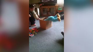 "Cute Baby Climbs into Box"