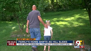 Family's Miami Township home shifts as hill slides