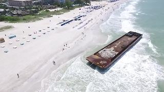 Storm leaves 40-ton barge on St. Pete beach