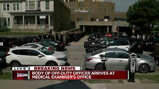 Hearse carries fallen Racine officer to Medical Examiner's Office