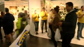 Customers entering IKEA with cheers