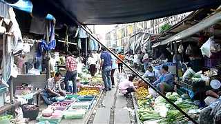 This Market In Bangkok Is Set Up Right On Active Train Tracks