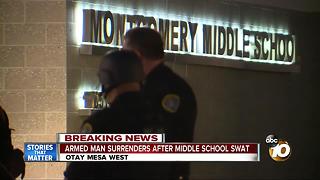 Armed man surrenders after middle school standoff