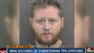 Man accused of threatening TPD officers