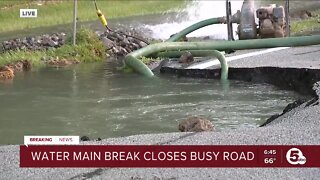 Water main break closes busy road