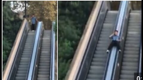 Guy Slides Down Escalator