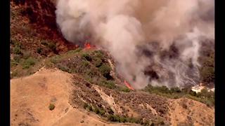 LA County Firefighters fight blaze in Newhall Pass area