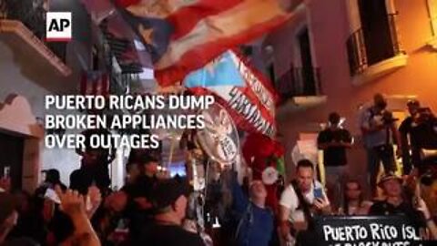 Puerto Ricans dump broken appliances on steps of town hall over power outages