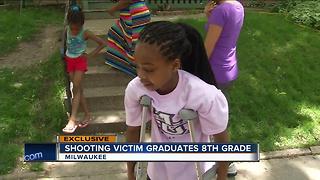 Shooting victim graduates eighth grade