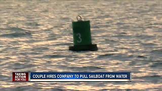 Couple hires company to pull sailboat from water