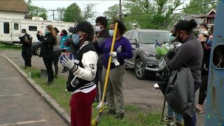 Community responds to violence with volunteer cleanup
