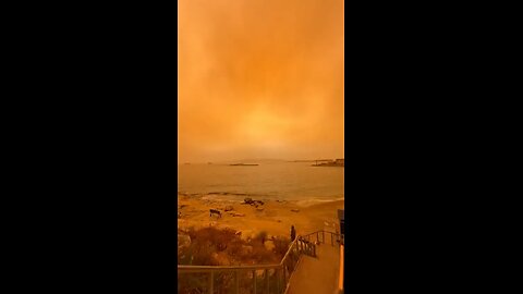 African dust shrouding Greece casts an otherworldly orange glow