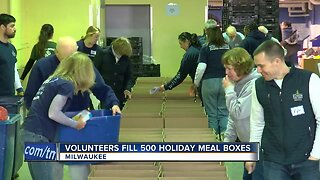50 volunteers fill 500 holiday meal boxes for families in need