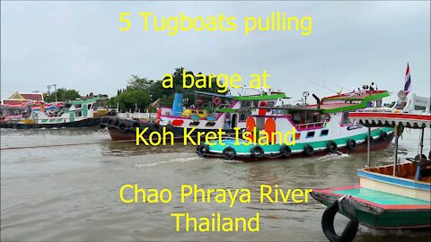 5 Tugboats pulling a barge of Koh Kret at Chao Phraya river in Thailand