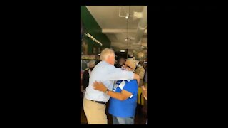 Maskless Terry McAuliffe Hugs People Inside a Packed Restaurant