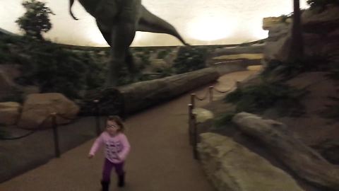 Two Kids Run Away Scared When An Interactive Motion-Sensor T-Rex Moves