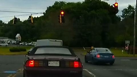 Speeds up to run red light