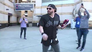 Jason Kipnis holds his annual shoe toss