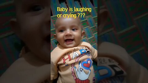 Baby is laughing or crying??
