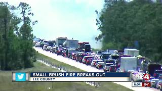 Crews battle brush fire along I-75 in Lee County
