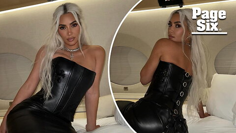 Kim Kardashian poses on private jet in multi-buckled leather corset