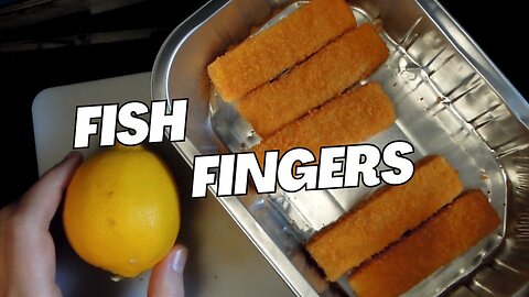 Cooking Fish Fingers Fish Sticks Backed with lemon and served with grilled vegetables