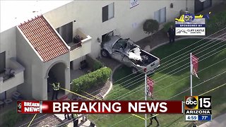 Truck crashes into building in Mesa