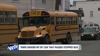 Third-grade girl getting off school bus struck by car in Cleveland