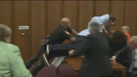 Dad jumps over table to attack Daughter's killer in court