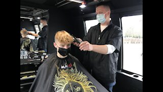 Kenosha barber's unique way to stay open during pandemic
