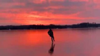 Scenic winter sunset on frozen lake