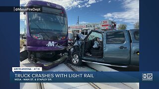 Truck crashes with light rail in Mesa