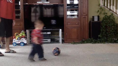 Cute Toddler Boy Crashes Into A TV While Playing Soccer