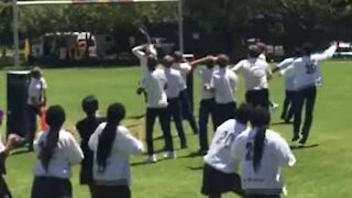 Kid throws traffic cone on top of rugby post