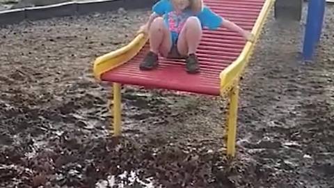 Girl Slides Down And Falls In Mud