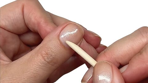 Why you should be nudging the skin fold back even with polish on. [Pro nail technician explains]