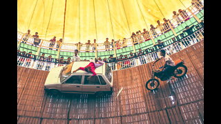 Vehicles Ride At High Speed On Walls In The "Well Of Death"