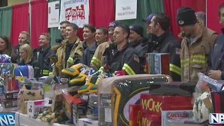 Green Bay firefighters break a donation record during their Gifts for Teens drive