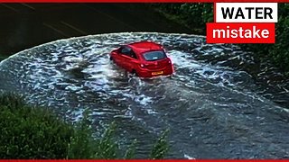 Two men trapped after driving into flood
