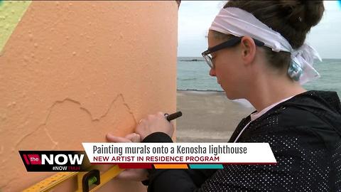 Artist painting mural at Kenosha lighthouse