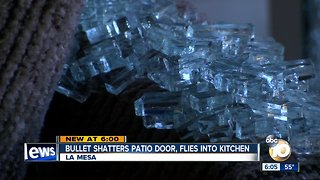 Bullet shatters patio door, flies into kitchen