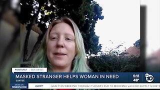 Masked stranger helps woman in need