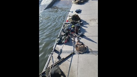 Found large rug, Fishing pole, golf balls, sunglasses, fishing pole holder sunny day at lake saguaro