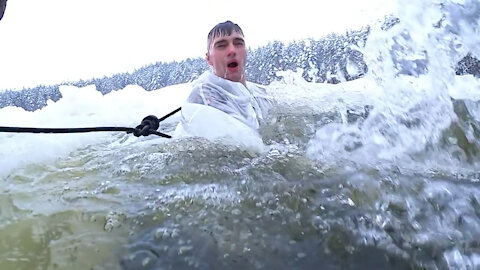 UK troops take the plunge into icy water in freezing conditions